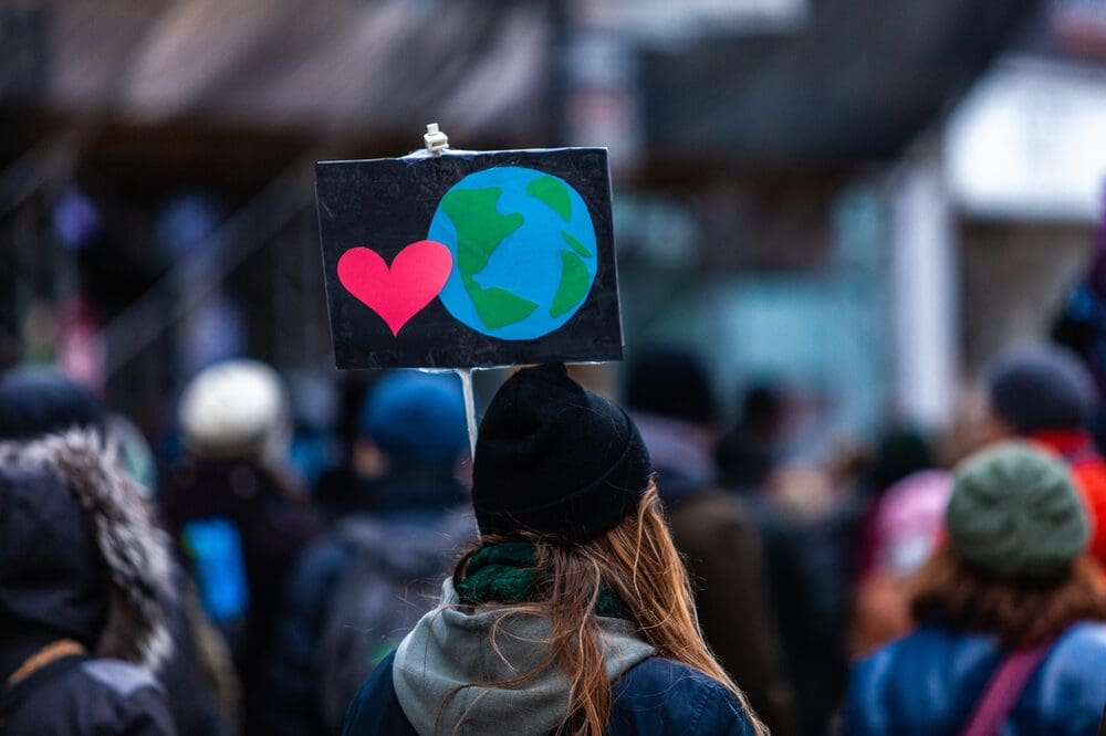 an eco friendly protestor with sign